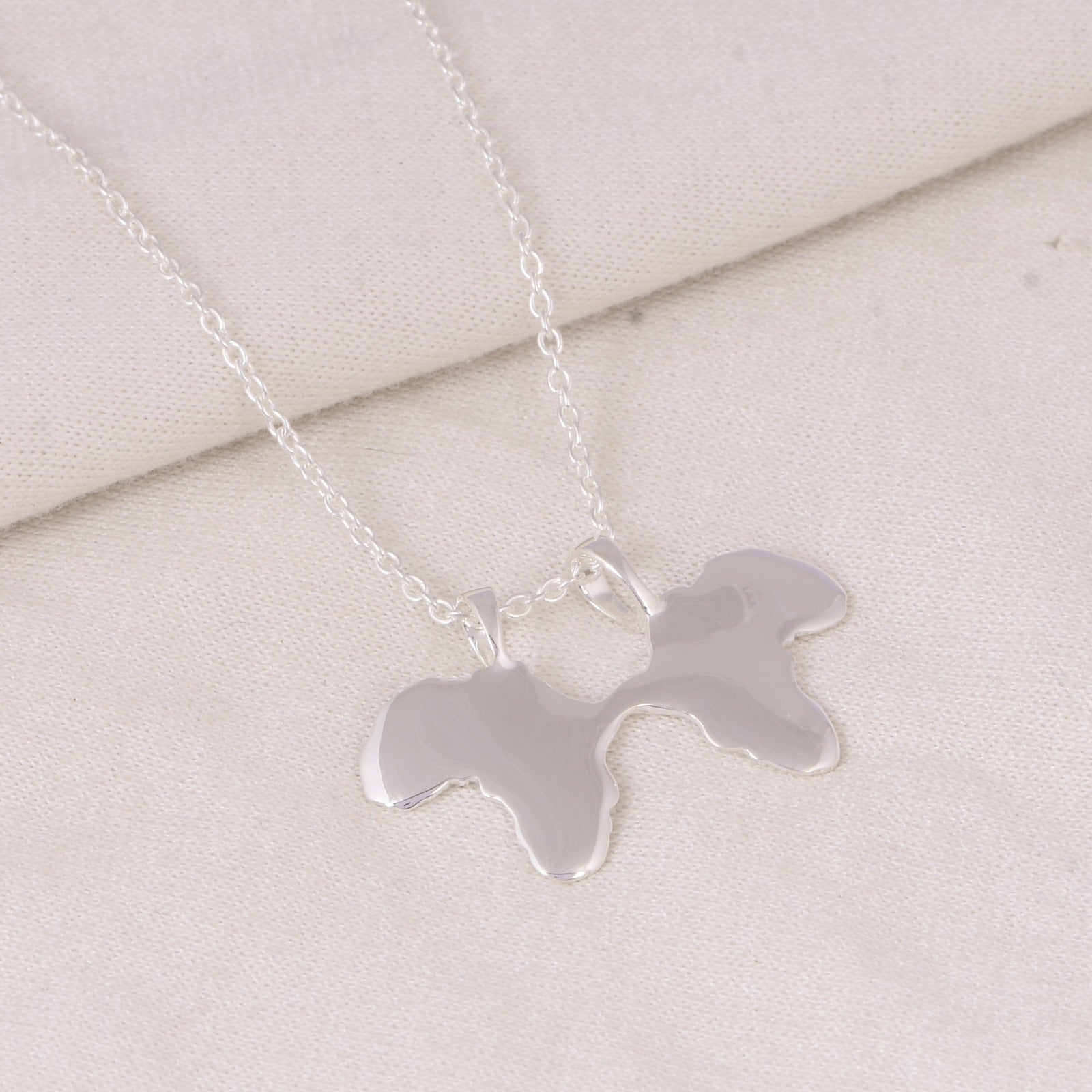 Small Finor X Silver Logo Pendant